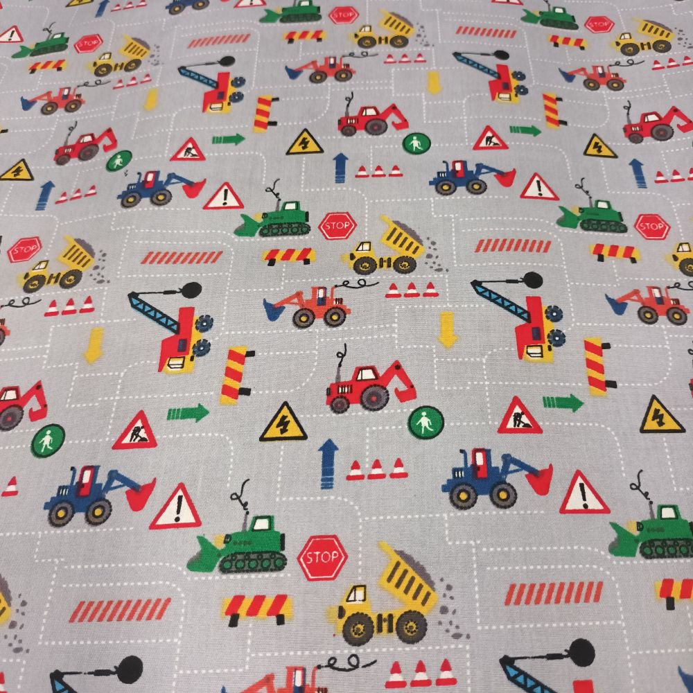 Puuvillapopliin, väiksed ehitusmasinad hallil