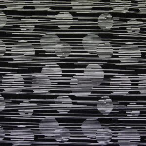 Žakaarmustriga kahepoolne kangas, valged ringid mustal